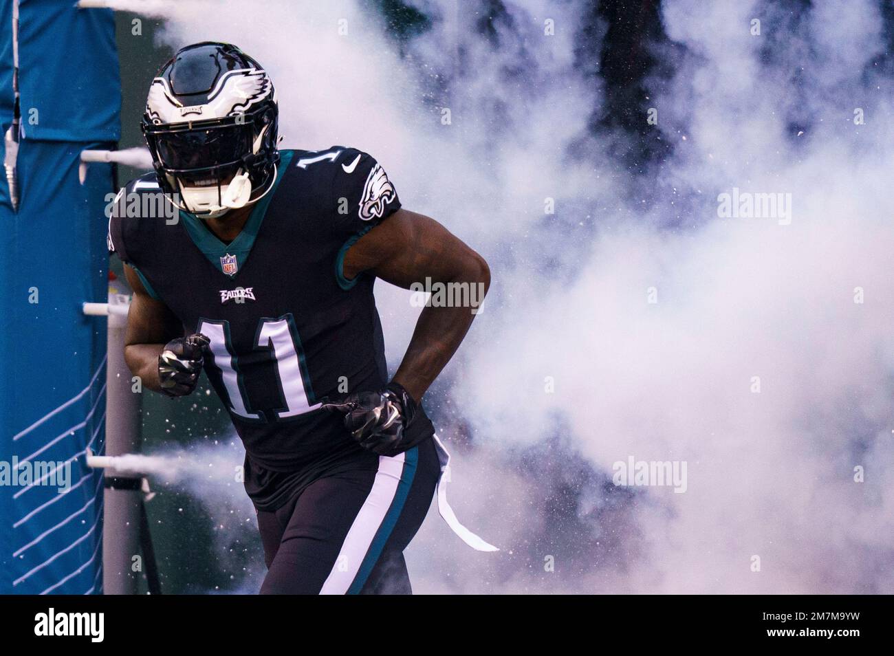 Philadelphia Eagles wide receiver A.J. Brown (11) comes through the smoke  prior to the NFL football game against the New York Giants, Sunday, Jan. 8,  2023, in Philadelphia. (AP Photo/Chris Szagola Stock