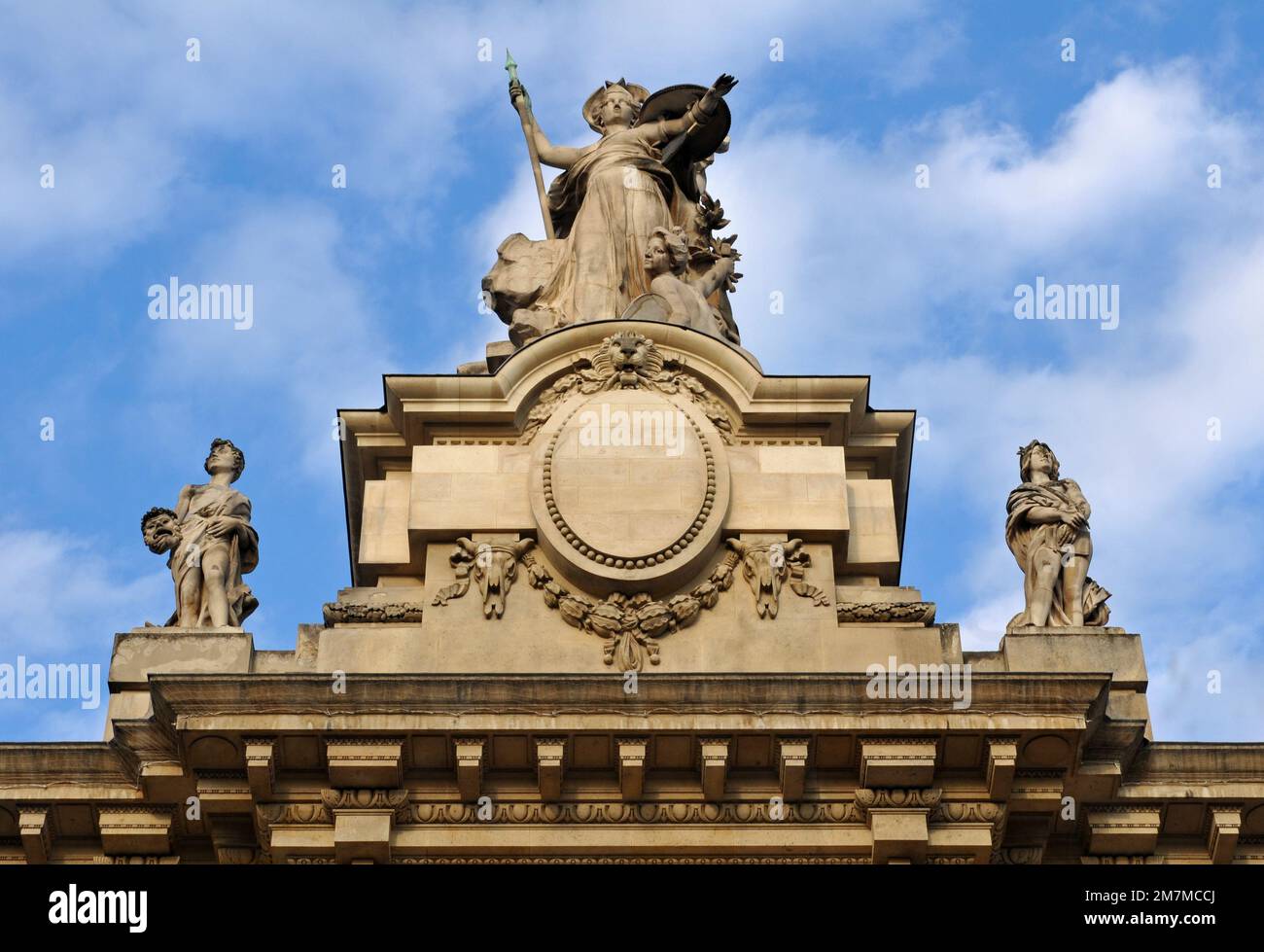 Sculptures atop the landmark Grand Palais in Paris. Built for the 1900 Paris Exhibition (world's fair), it's now an exhibition hall and museum complex. Stock Photo