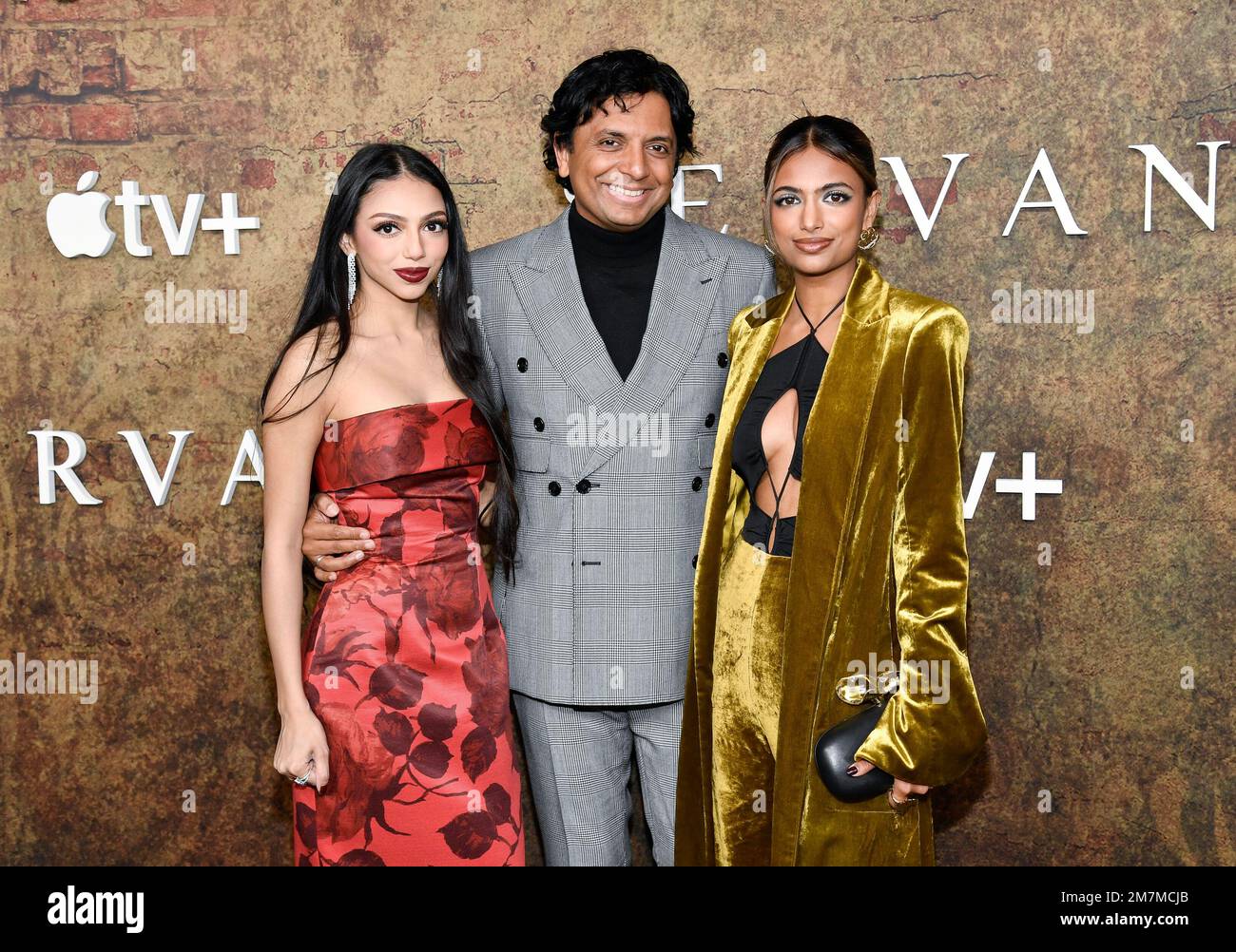 M. Night Shyamalan, center, and daughters Saleka Shyamalan, left, and