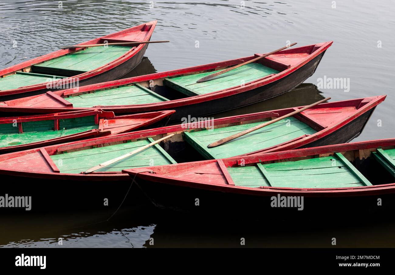 A row of parked wooden boats on the river close up Stock Photo - Alamy