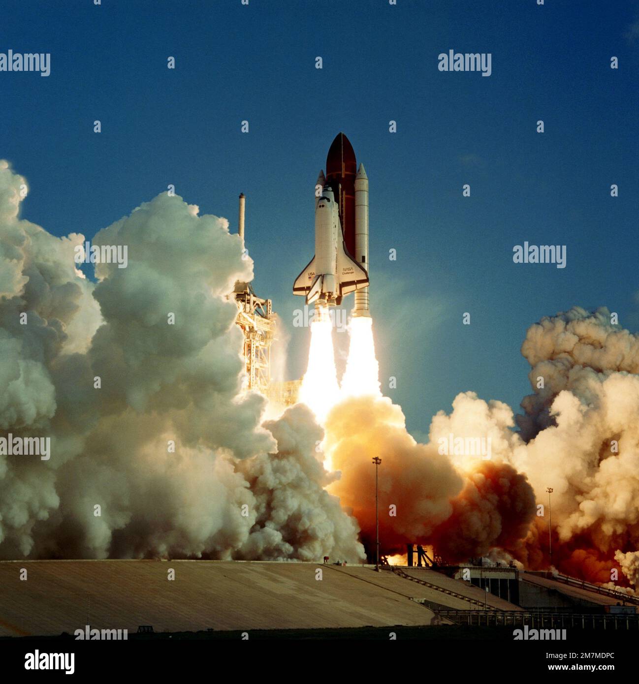 A ground-to-air view of the space shuttle Challenger during liftoff from launch complex 39A at 7:33 a.m. EDT. Aboard the Challenger for the seventh launch of the Space Transportation System are CMDR
