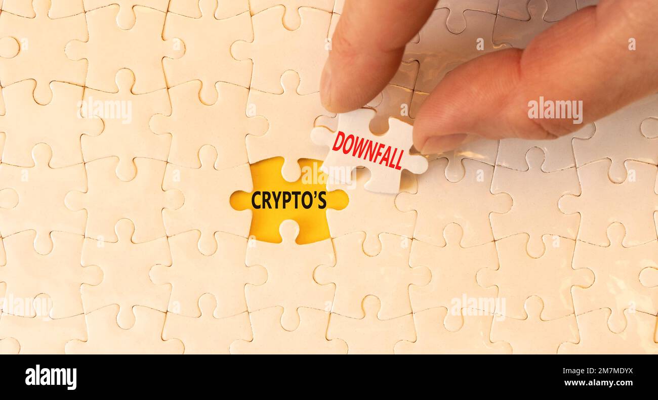 Crypto downfall symbol. Concept words Cryptos downfall on white paper  puzzles. Beautiful yellow table white background. Businessman hand.  Business and Stock Photo - Alamy