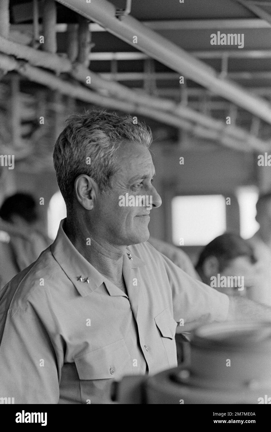 Rear Admiral Frederick F. Palmer, Commander, Amphibious Group Two, on the bridge of the amphibious command ship USS MOUNT WHITNEY (LCC 20) while en route to the allied Exercise TEAM WORK '76. The exercise is scheduled for September 15-24. Subject Operation/Series: TEAM WORK '76 Country: Unknown Stock Photo