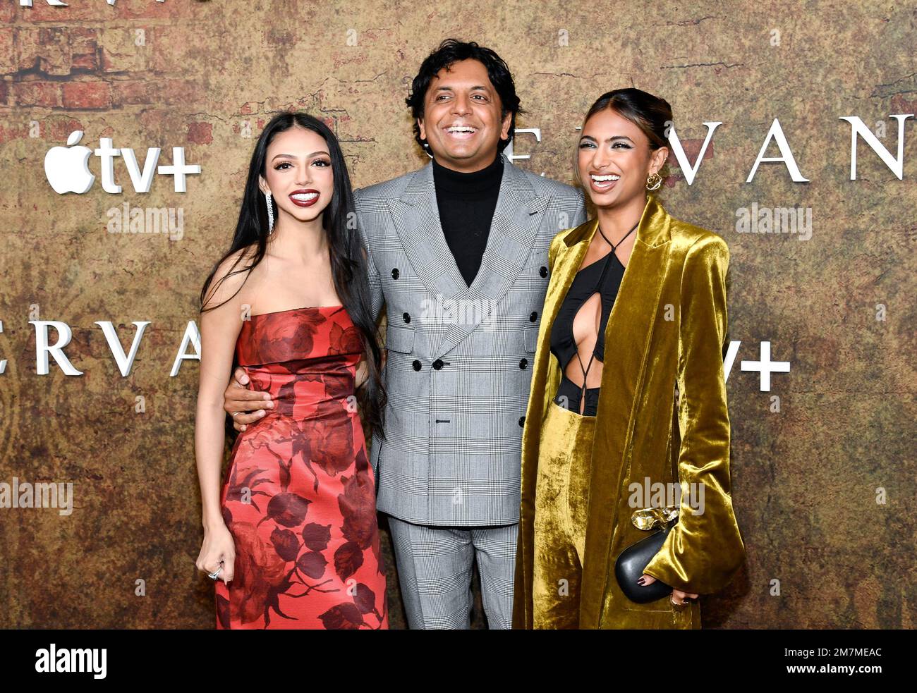 M. Night Shyamalan, center, and daughters Saleka Shyamalan, left, and