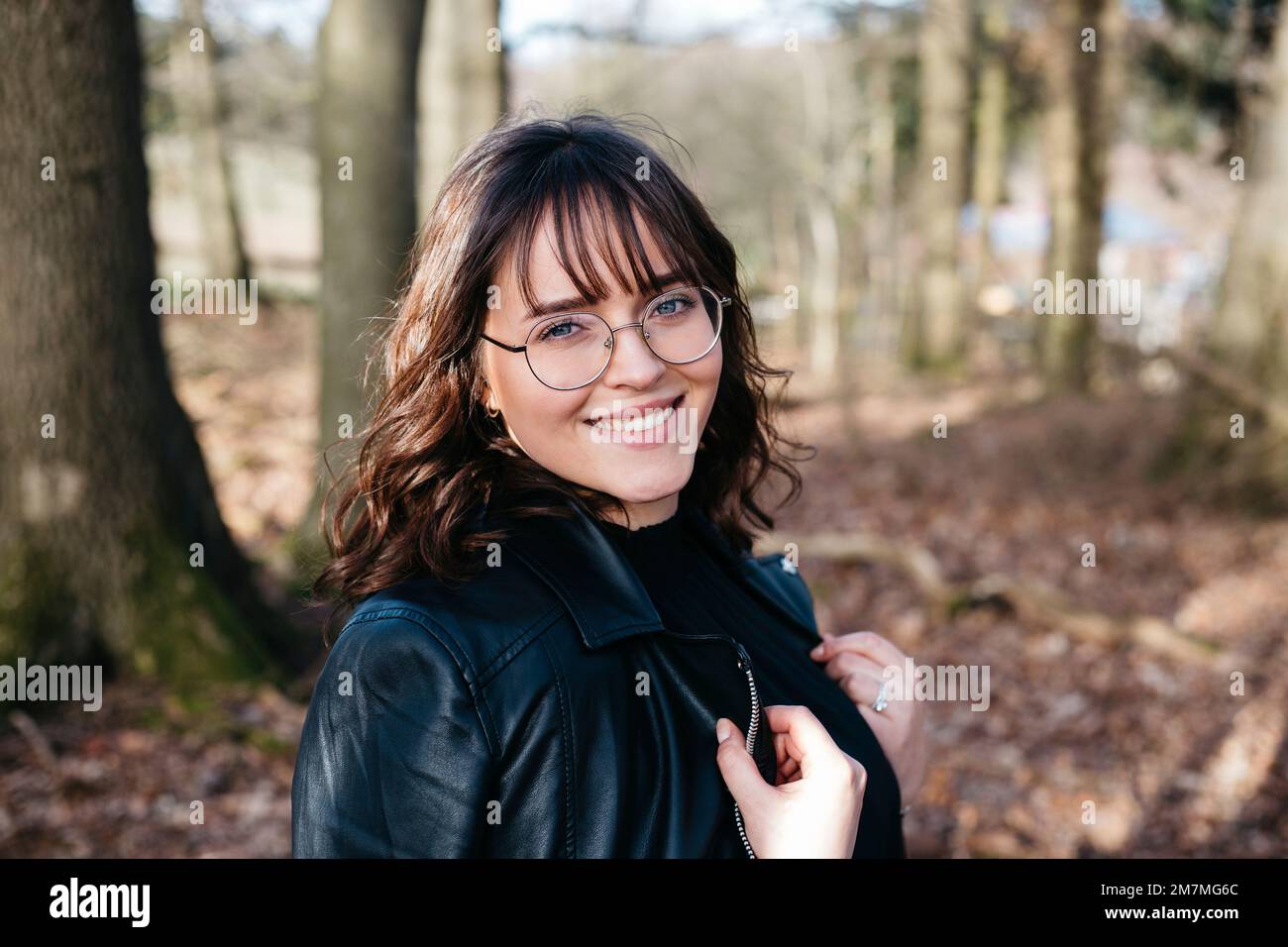 Happy laughing woman in forest Stock Photo