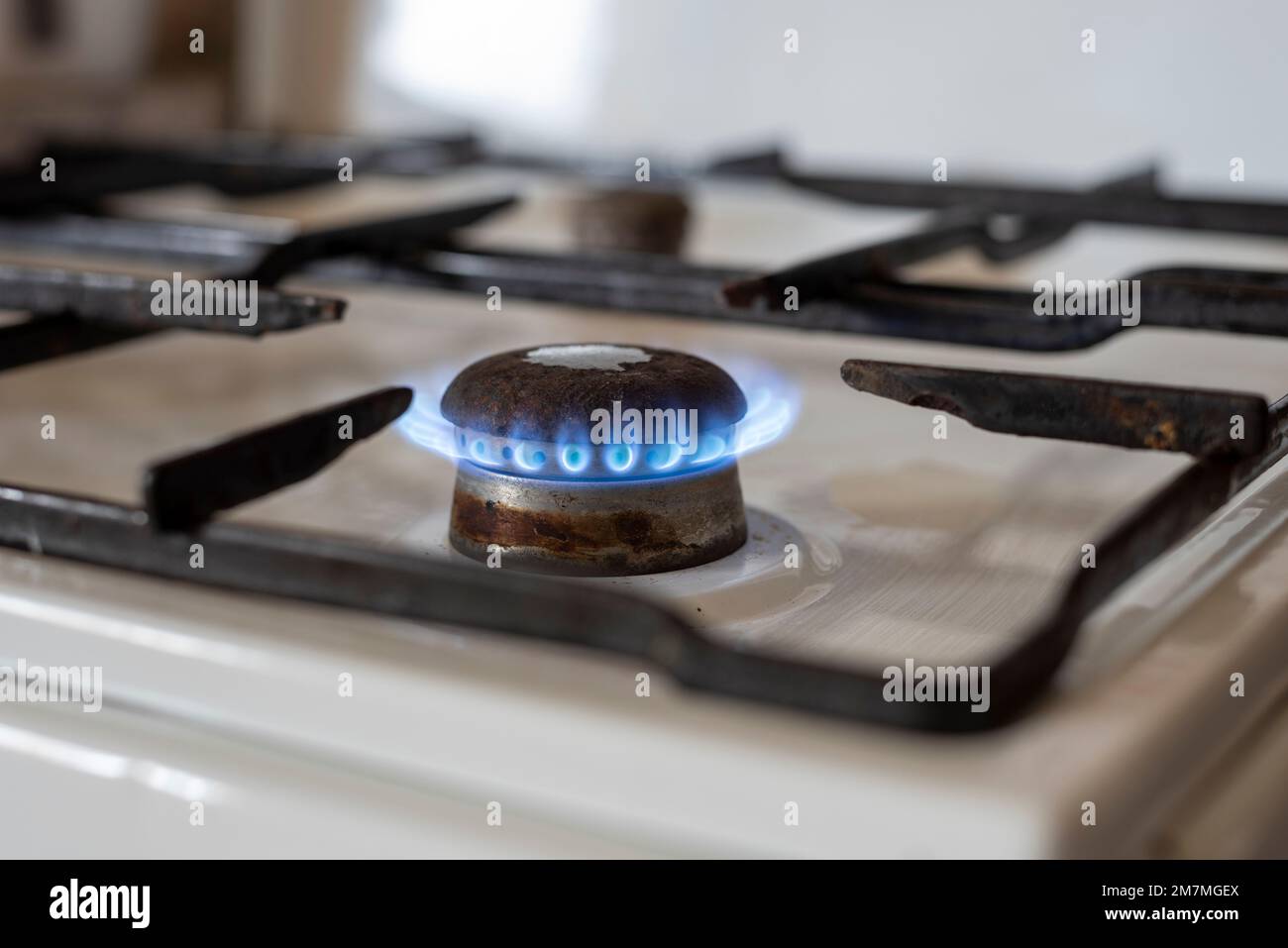 The flame of an old gas stove burns in a kitchen Stock Photo Alamy