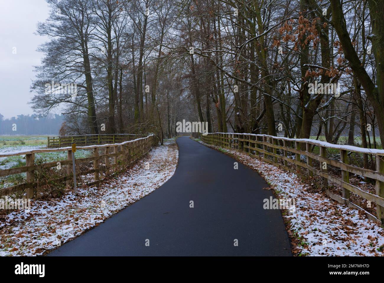 Early winter, bike path with a little snow along the way, risk of ...