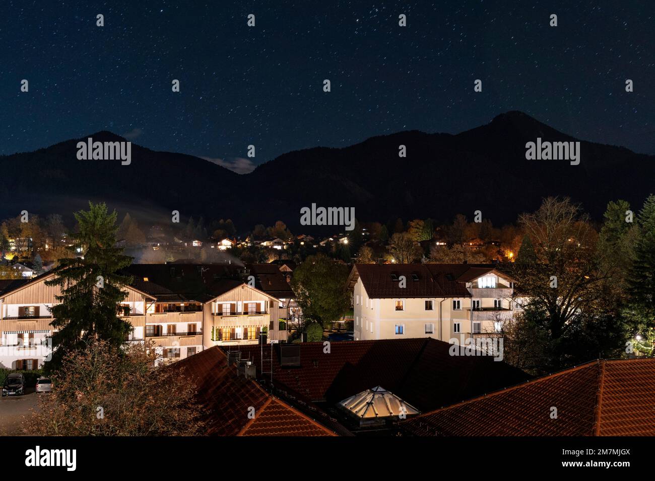 Europe, Germany, Southern Germany, Bavaria, Upper Bavaria, Bavarian Alps, Lenggries, view over evening Lenggries with mountain scenery in background Stock Photo