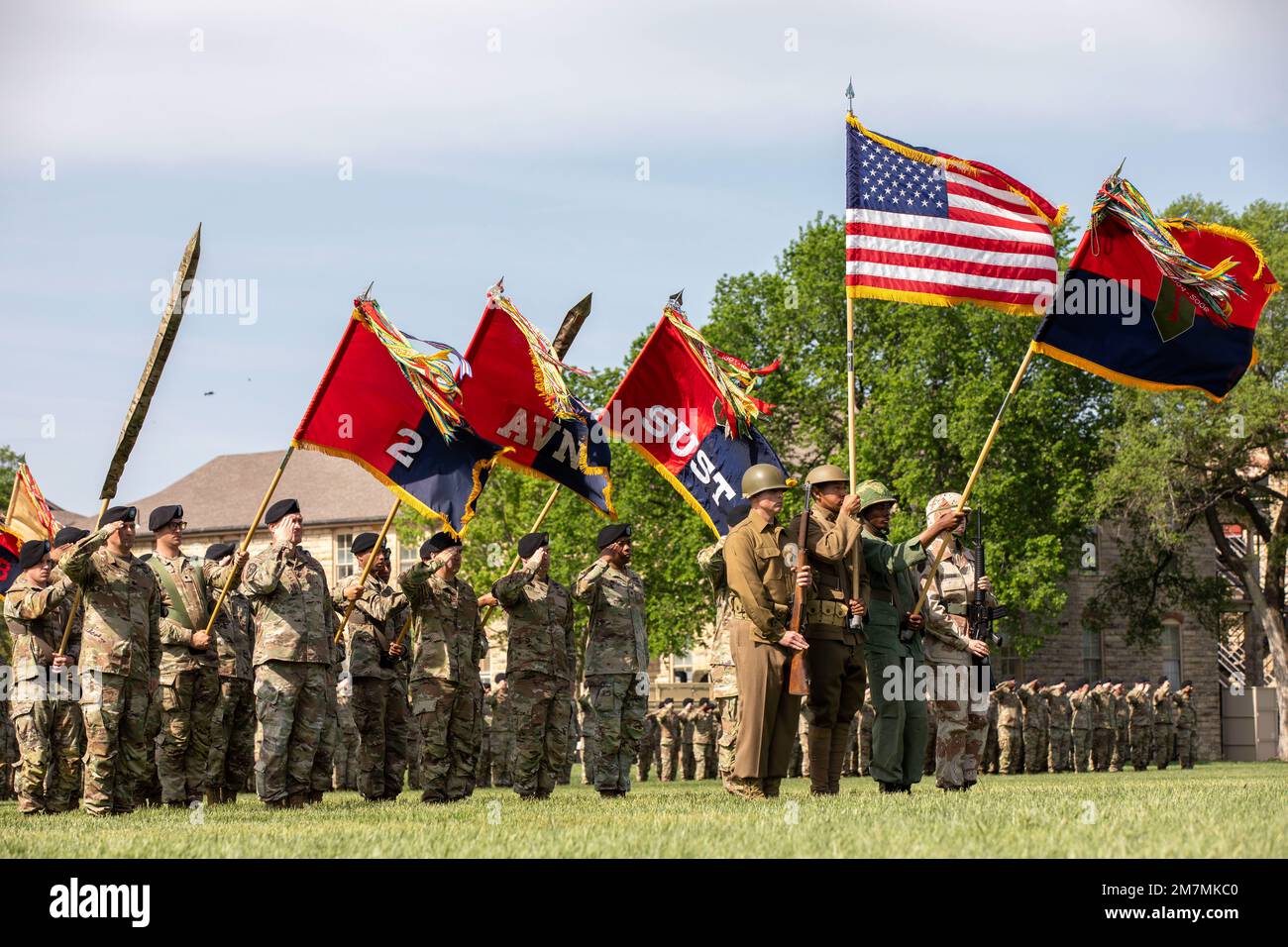 Fort Riley Division Song Units of the 1st Infantry Division present arms during the playing of ...