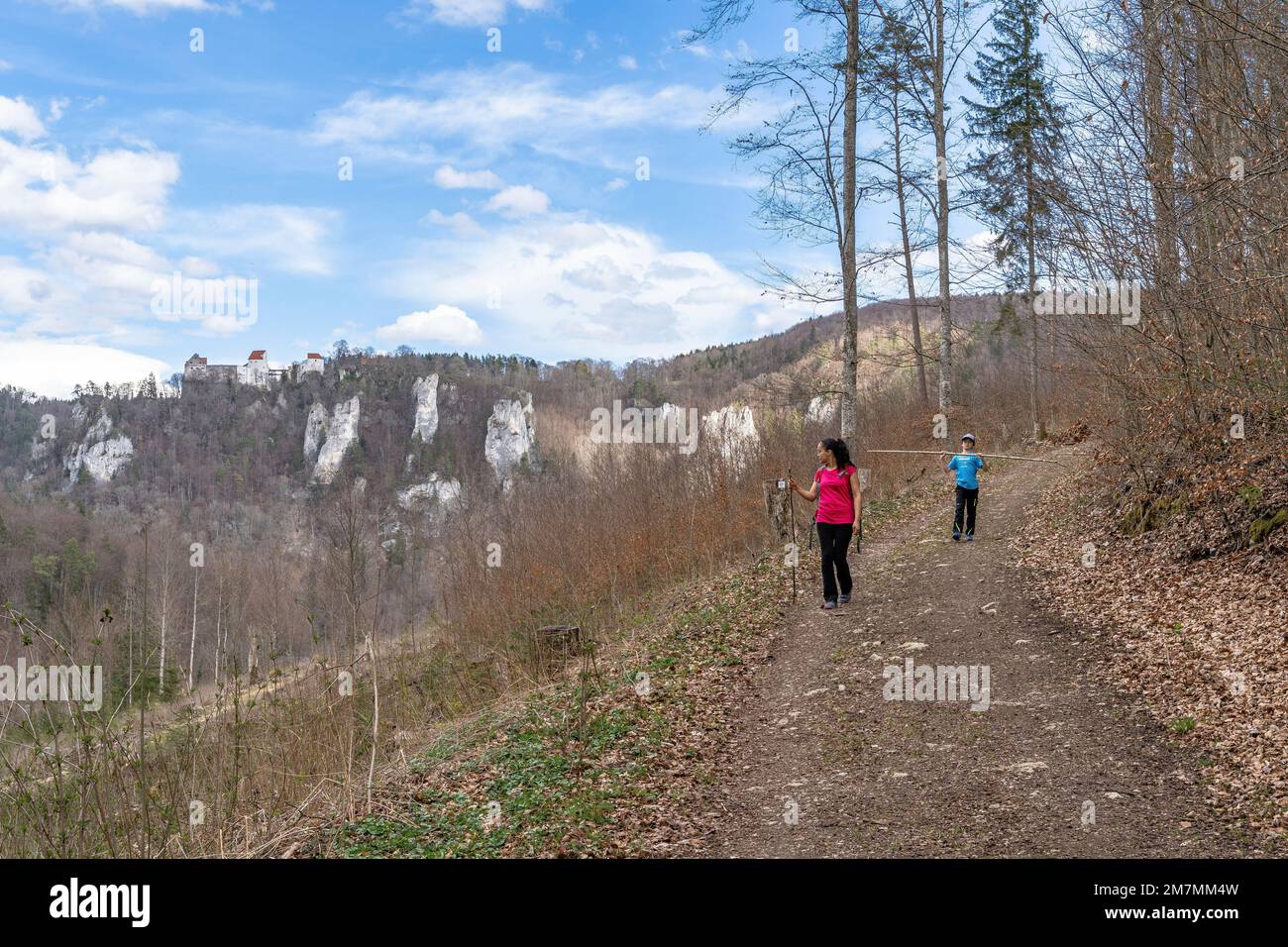 Europe, Germany, Southern Germany, Baden-Wuerttemberg, Danube valley, Sigmaringen, Beuron, mother and son hiking on a forest path above Danube valley Stock Photo