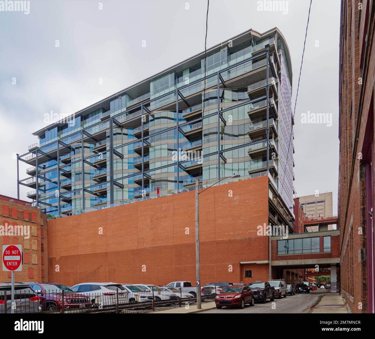 Picture of Glass-faced Pinnacle Condominiums are perched on concrete piers above ...