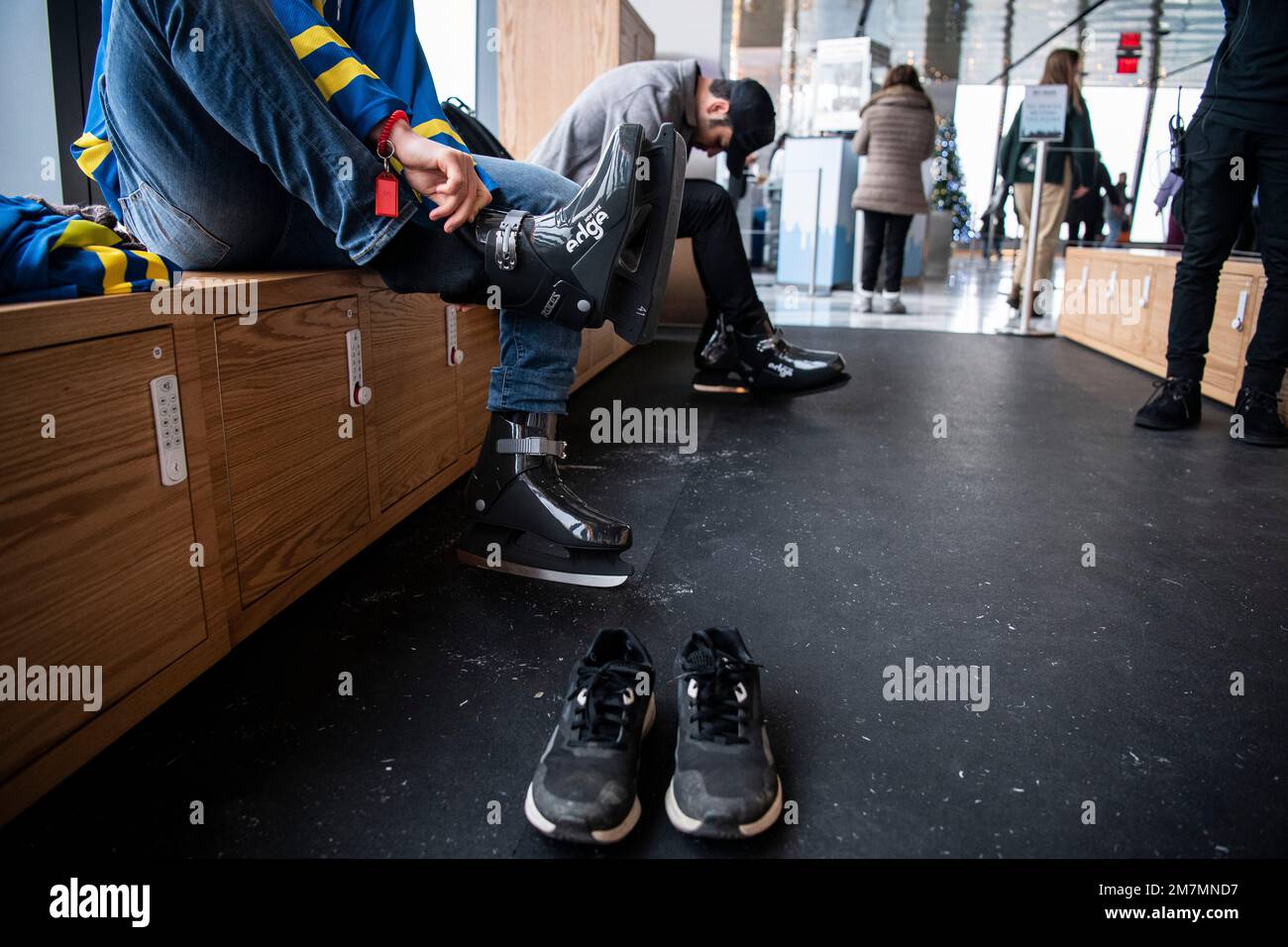People put on their skates before gliding above New York City at Sky