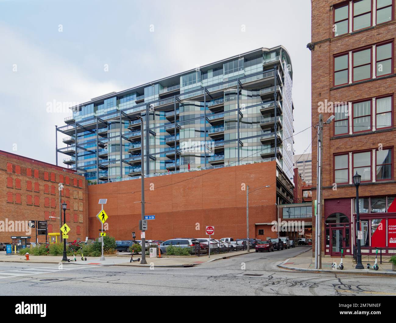 Glass-faced Pinnacle Condominiums are perched on concrete piers above ...