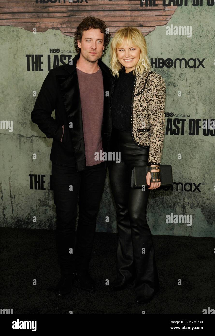 Malin Akerman poses with her husband Jack Donnelly at the premiere of
