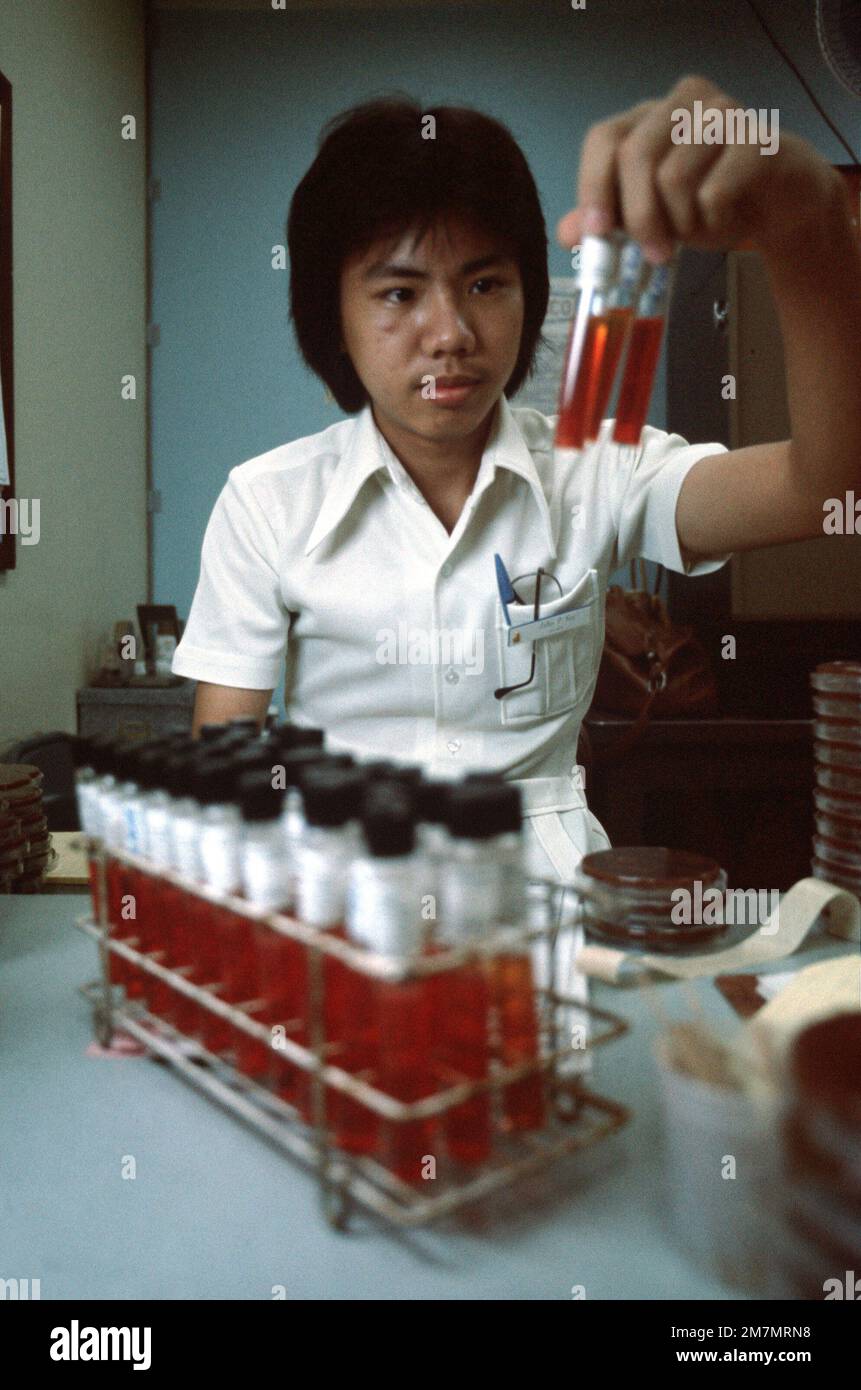 John See, a laboratory technician student, checks for sugar