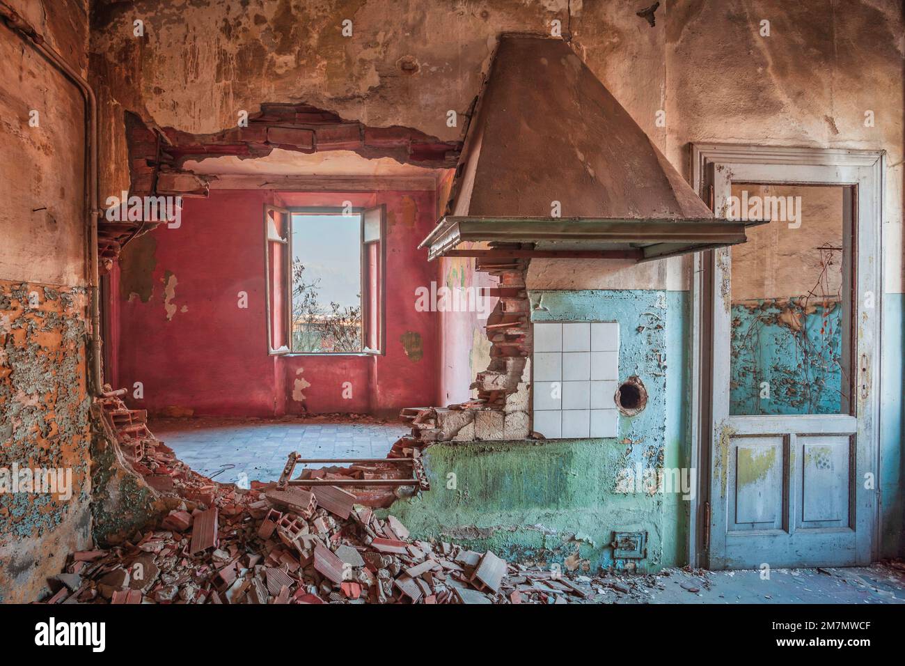 Italy, Veneto, interior of an abandoned house with vivid colors walls Stock Photo