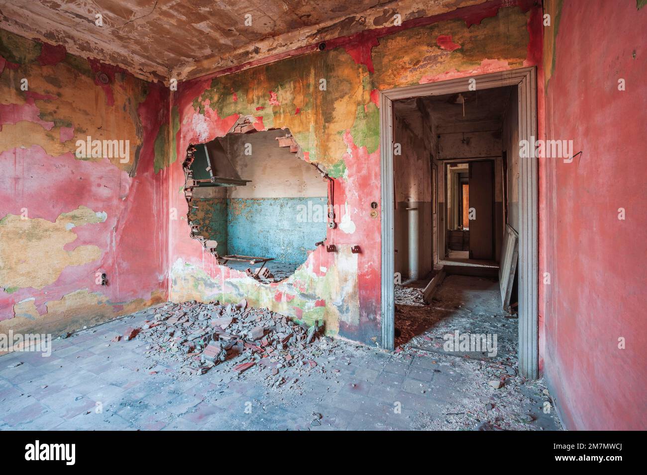 Italy, Veneto, interior of an abandoned house with vivid colors walls Stock Photo