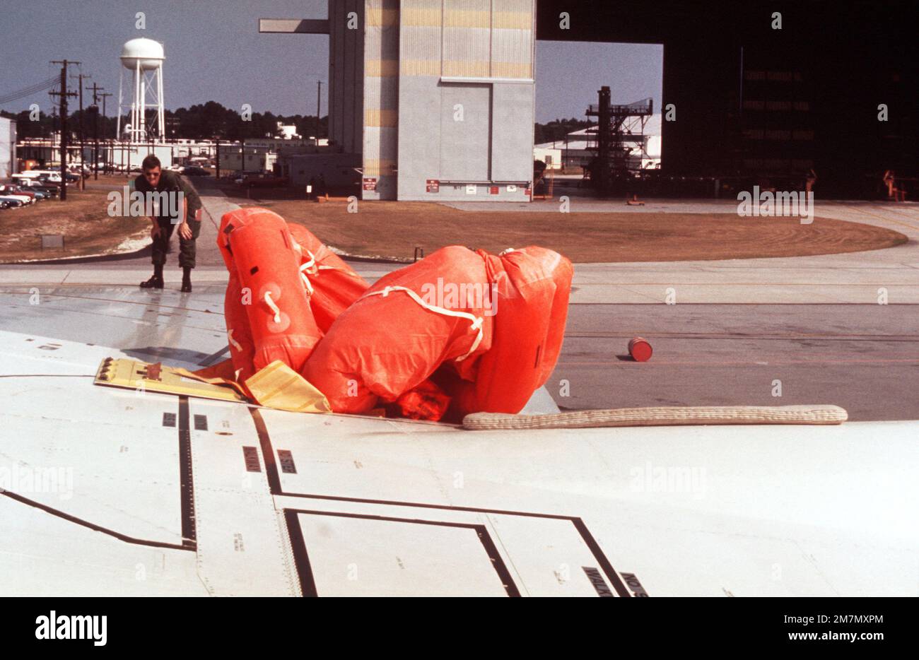 Dover Life Raft A life raft automatically inflates from the wing of an aircraft during ...