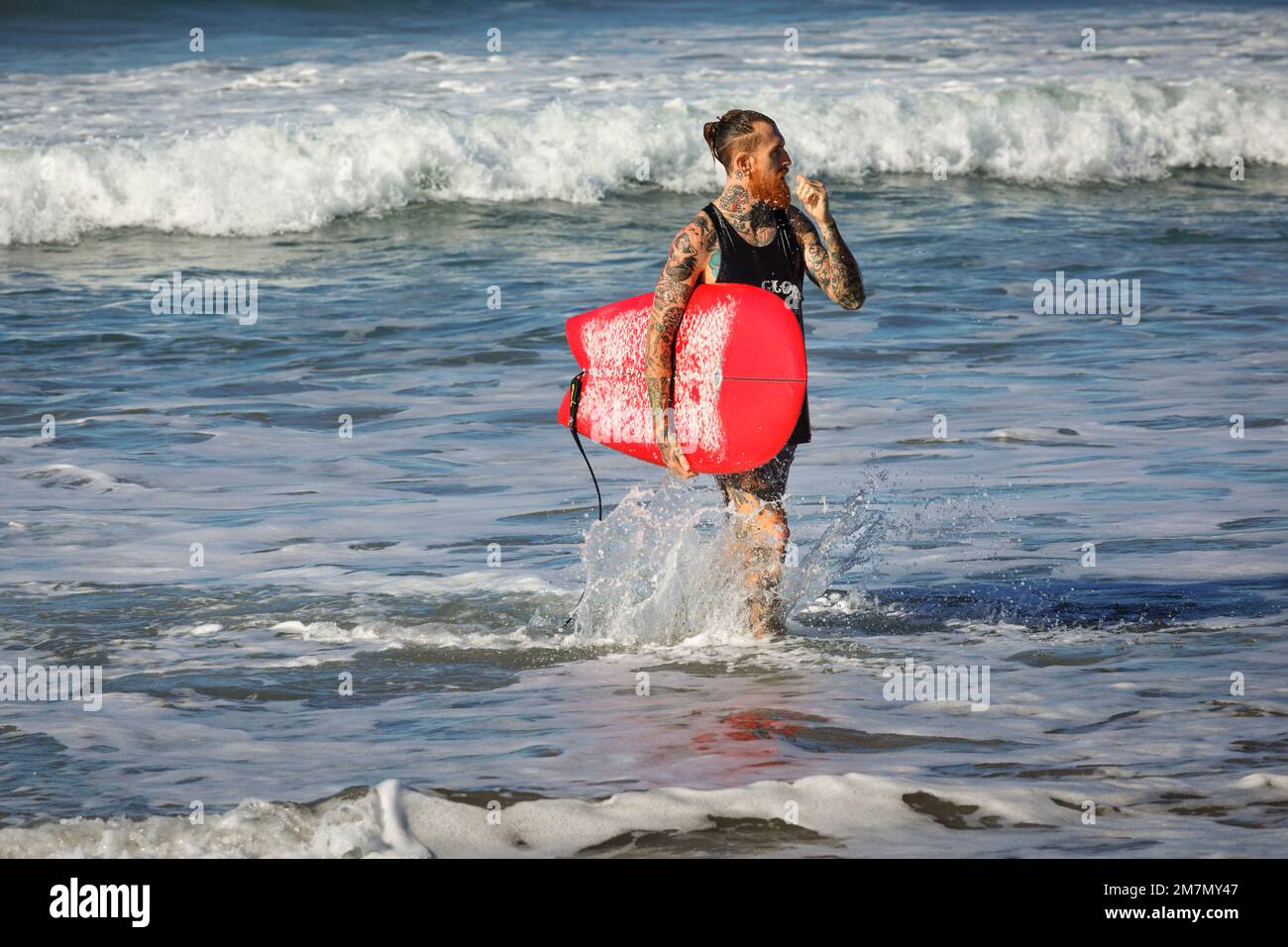 Surfer on the beach of Santa Teresa, Nicoya Peninsula, Guanacaste, Costa Rica, Central America Stock Photo