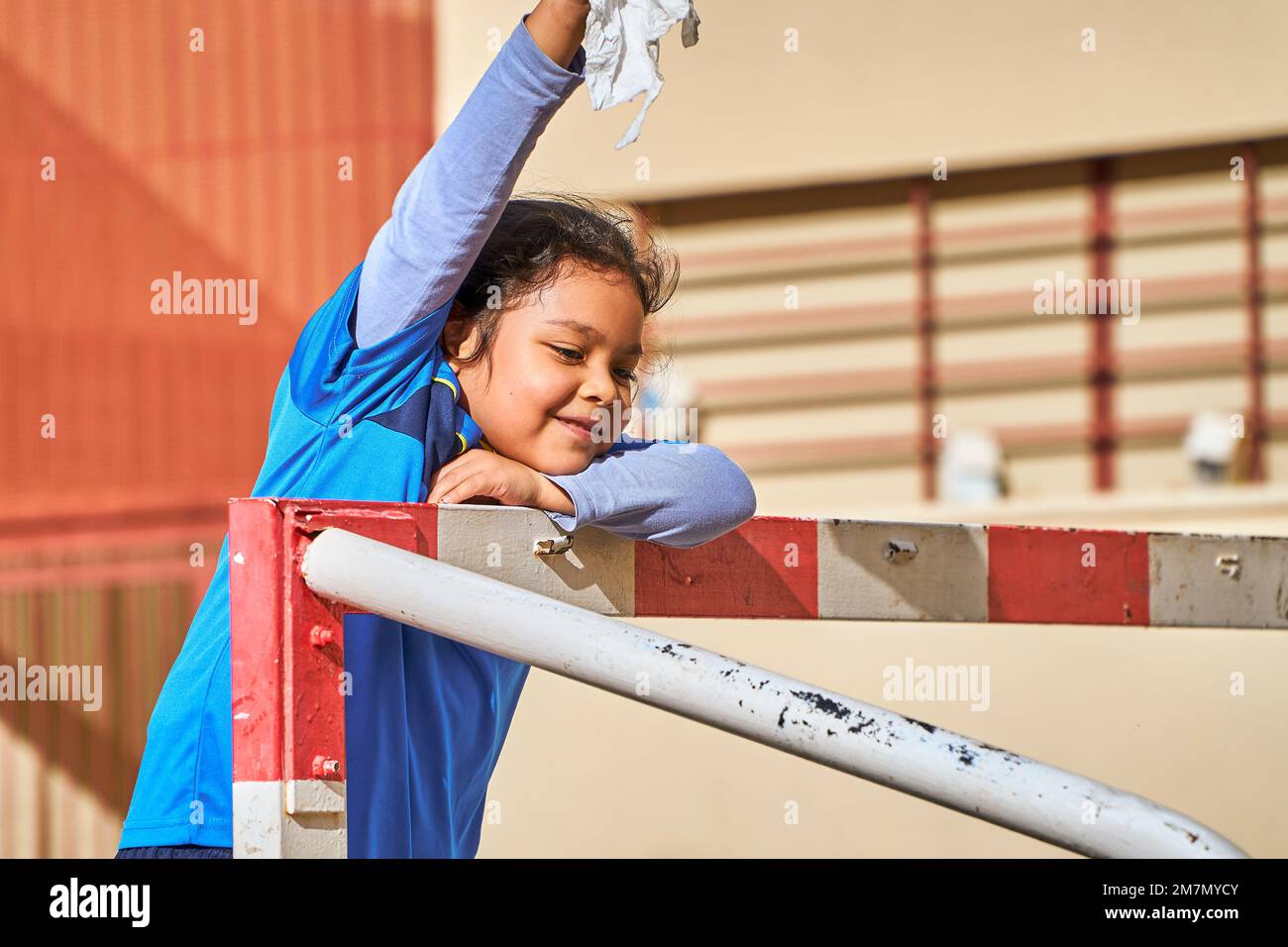 latin girl football player in a sport suit playing on a soccer goal Stock Photo