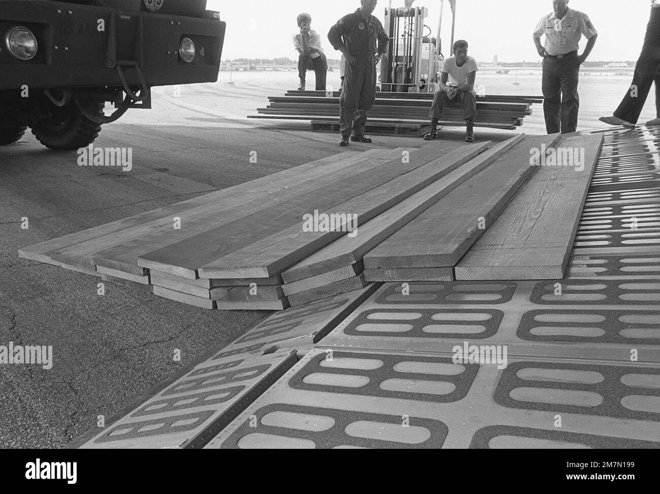 Wooden planks are used to build up the loading ramp of a C-5A Galaxy