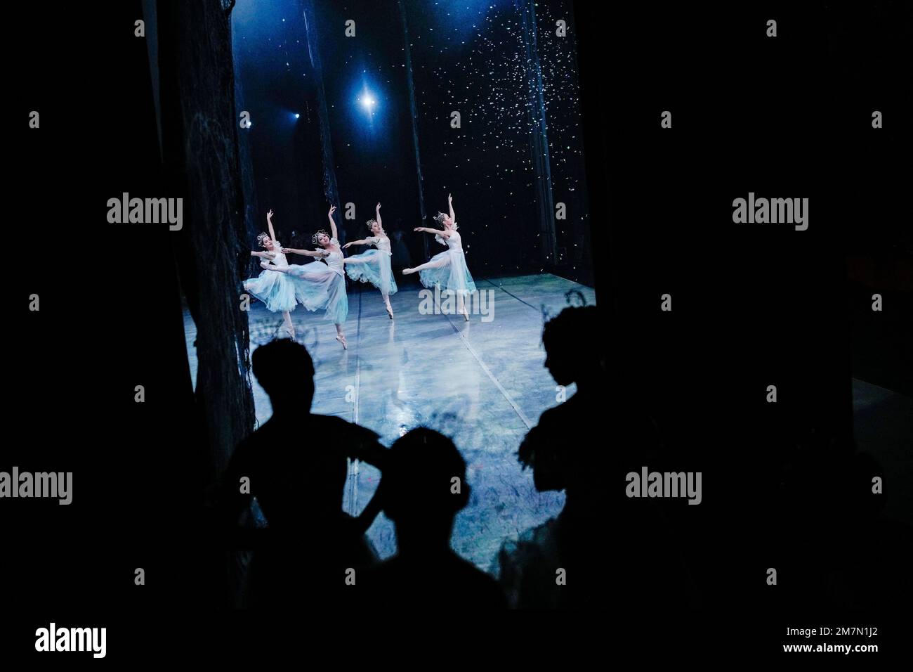 Ballet dancers go over their routines at a Nutcracker rehearsal inside