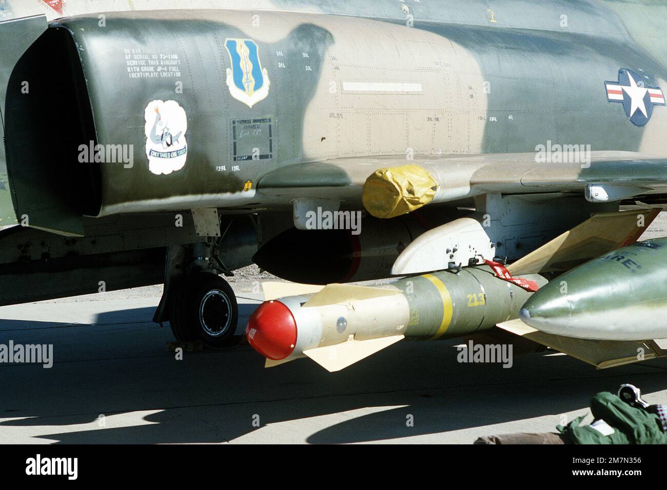 A GBU-15 glide bomb mounted on the wing pylon of an F-4 Phantom II aircraft at White Sands Missile Range. State: New Mexico (NM) Country: United States Of America (USA) Stock Photo
