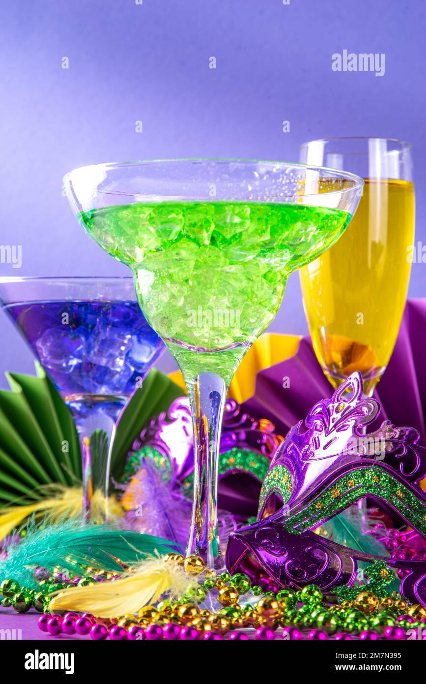 Mardi gras cocktails set. Colorful purple, yellow, green martini champagne  wine cocktail glasses for Mardi gras party bar with carnival decor and orle  Stock Photo - Alamy
