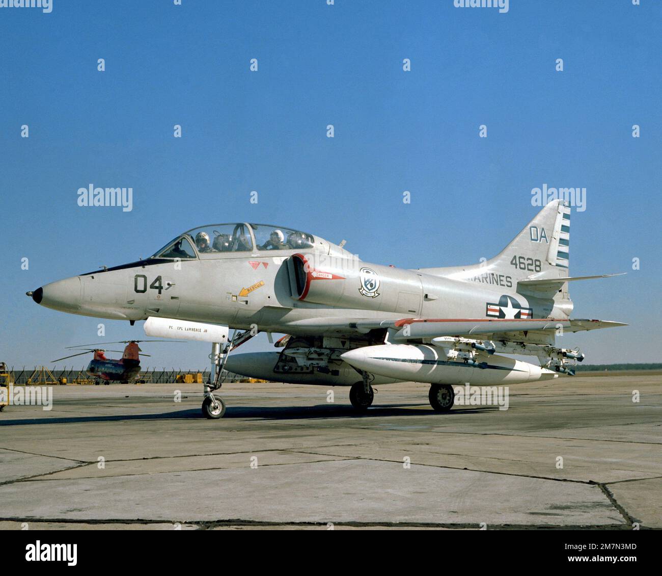 A left side view of a Marine TA-4F Skyhawk aircraft preparing to taxi from the flight line. The TA-4F is from the Headquarters and Maintenance Squadron-32. Base: Mcas, Cherry Point State: North Carolina (NC) Country: United States Of America (USA) Stock Photo