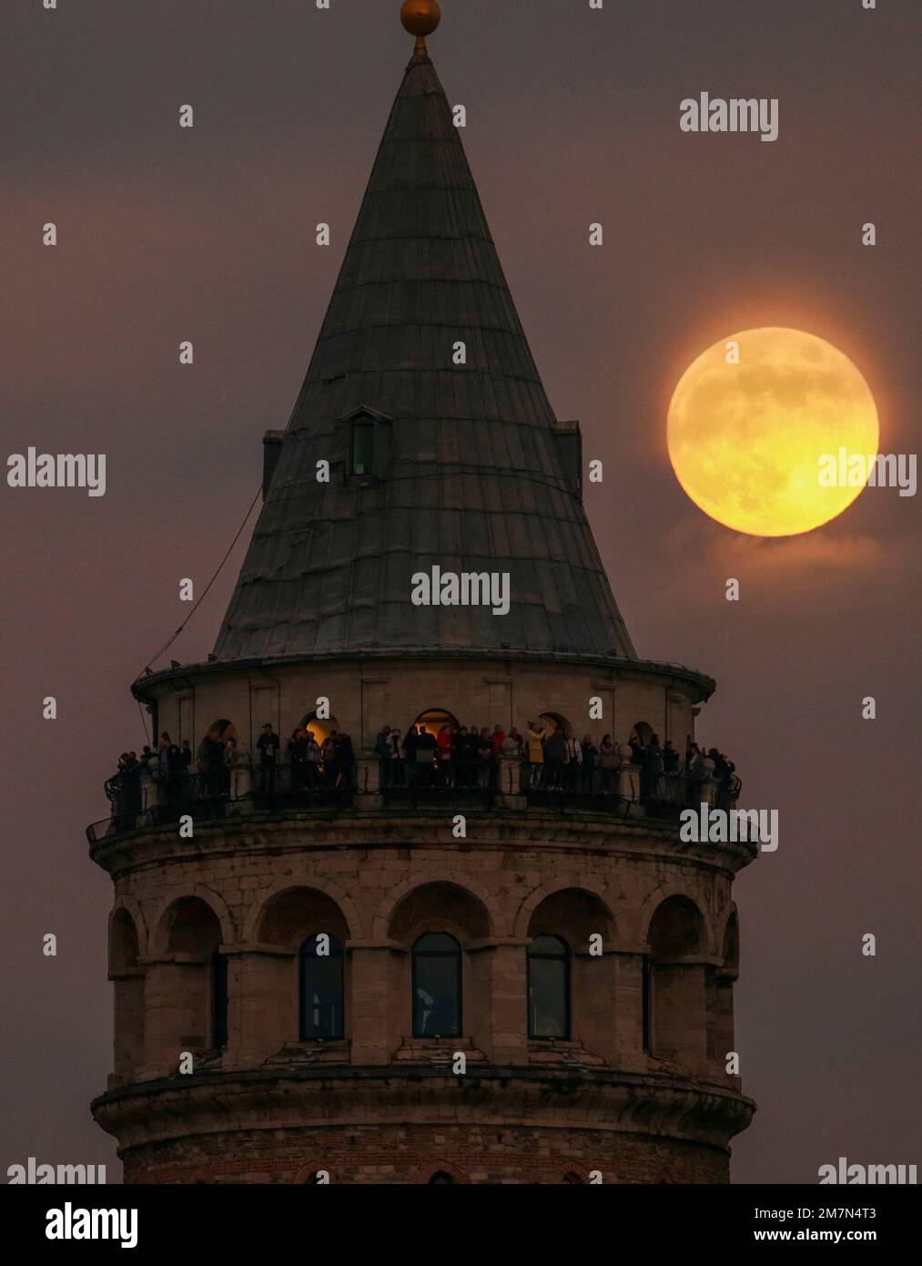 The last full moon of the year known as the Cold Moon rises behind ...