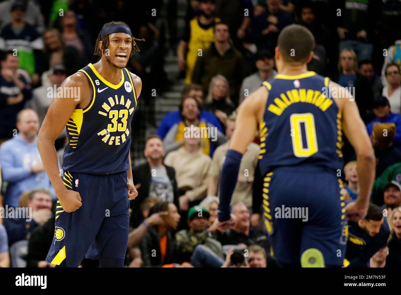 Indiana Pacers center Myles Turner (33) celebrates with Pacers guard Tyrese Haliburton (0) in the fourth quarter of an NBA basketball game against the Minnesota Timberwolve, Wednesday, Dec. 7, 2022, in Minneapolis. (AP Photo/Andy Clayton-King) Stock Photo