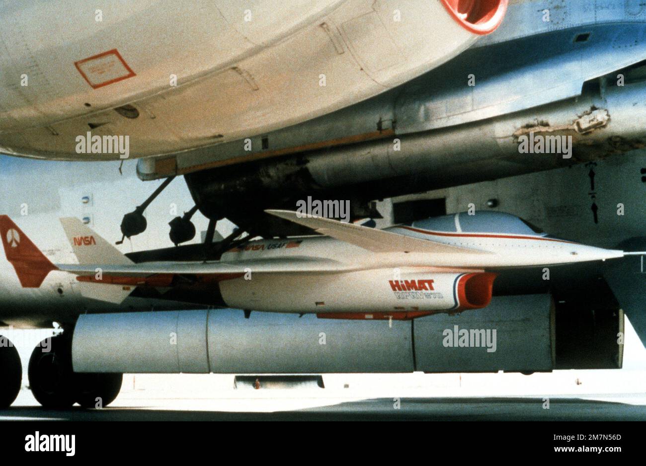 A front view of a highly maneuverable aircraft technology (HIMAT) flight vehicle under the wing of a B-52 Stratofortress aircraft before a test flight. Base: Edwards Air Force Base State: California (CA) Country: United States Of America (USA) Stock Photo