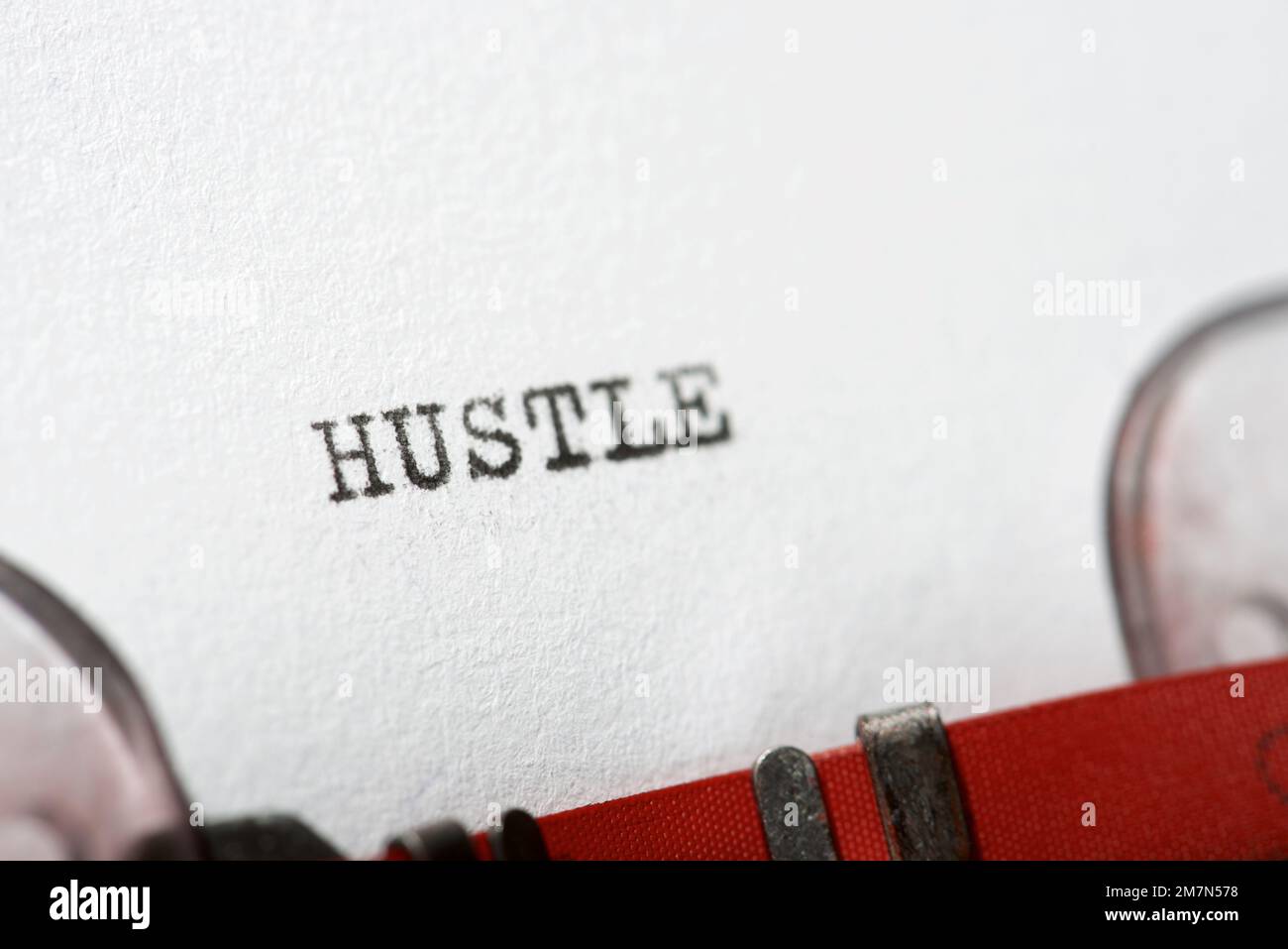 Hustle word written with a typewriter Stock Photo Alamy