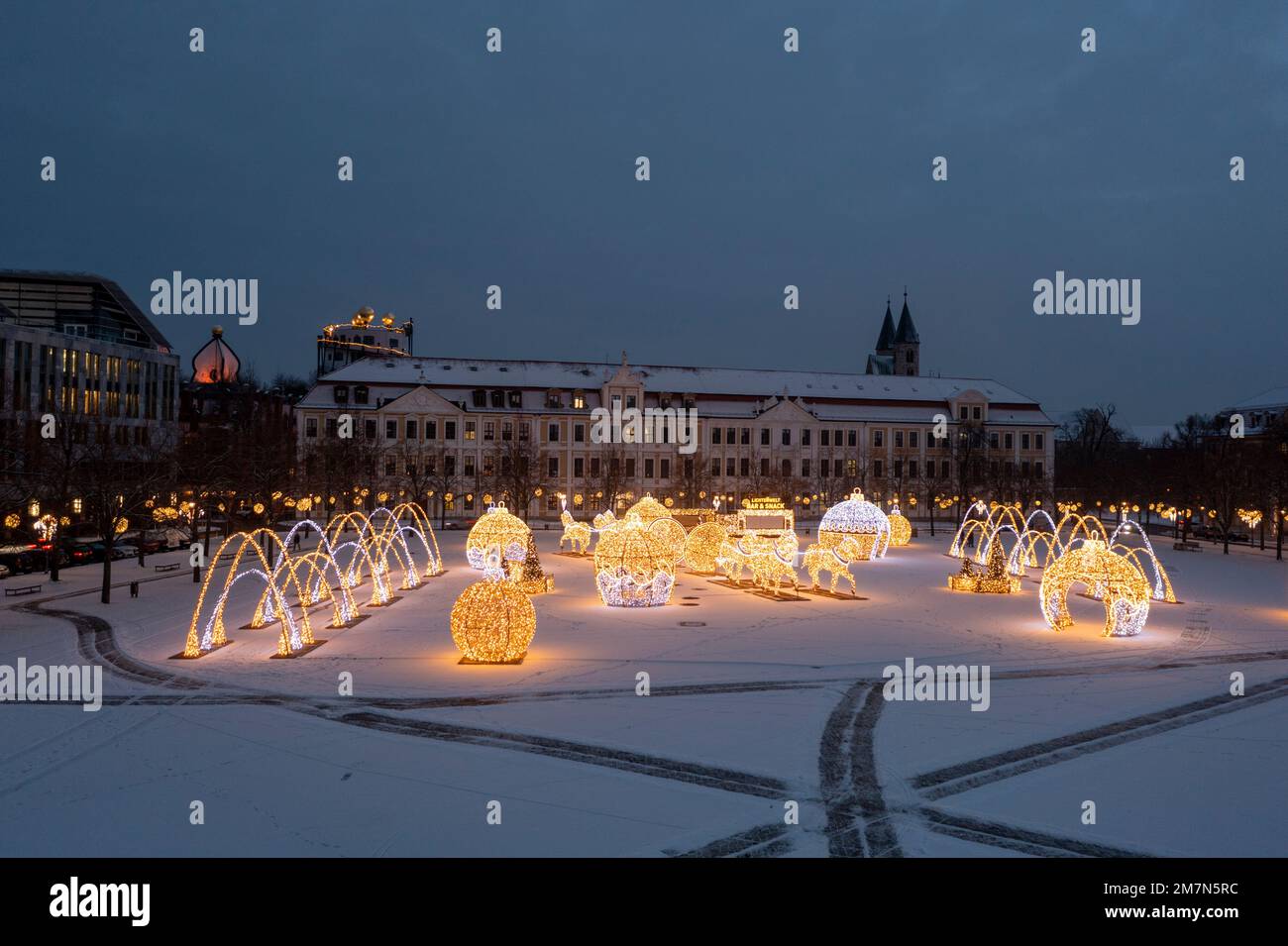 Snow covered cathedral square with Saxony-Anhalt state parliament, glowing Christmas trees, glowing Christmas balls, Christmas world of lights, Magdeburg, Saxony-Anhalt, Germany Stock Photo