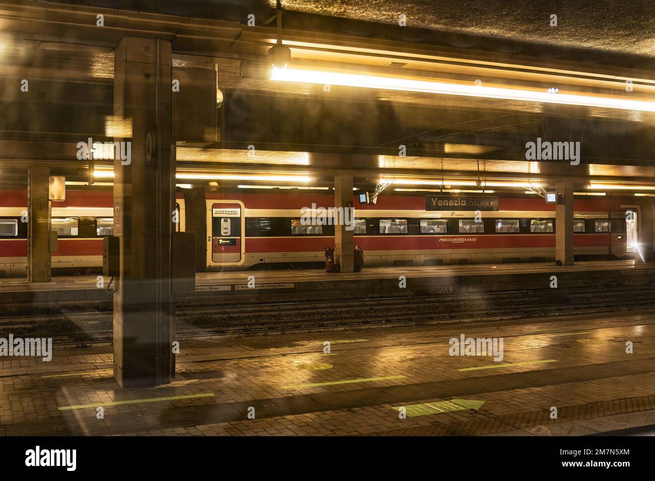 Venice, Italy 6 January 2023: Train in Railway station at night Stock Photo