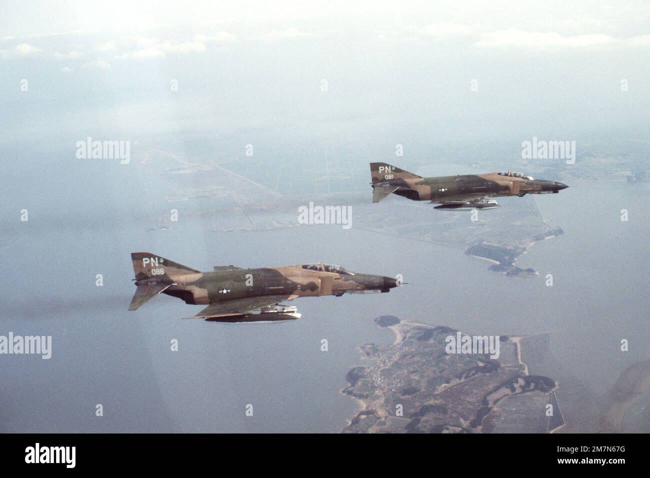 An air-to-air right side view of two F-4E Phantom II aircraft assigned to the 3rd Tactical Fighter Wing during the joint ROK/US training exercise TEAM SPIRIT '79. Subject Operation/Series: TEAM SPIRIT '79 Country: Republic Of Korea (KOR) Stock Photo