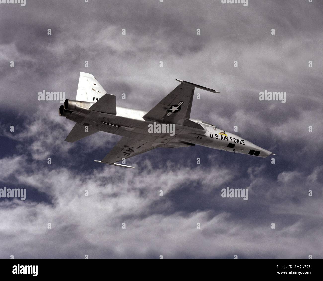 An air-to-air right underside view of an RF-5E reconnaissance system ...