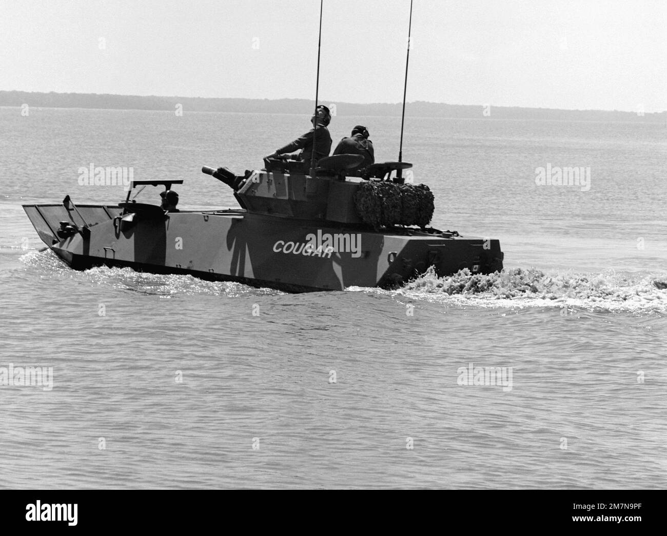 A Canadian armored vehicle general purpose (AVGP) Cougar demonstrates its amphibious abilities in the Potomac River. The Cougar is one of two AVGP being demonstrated before an audience of more than 100 Marines and civilians. Base: Marine Corps Dev&Ec, Quantico State: Virginia (VA) Country: United States Of America (USA) Stock Photo