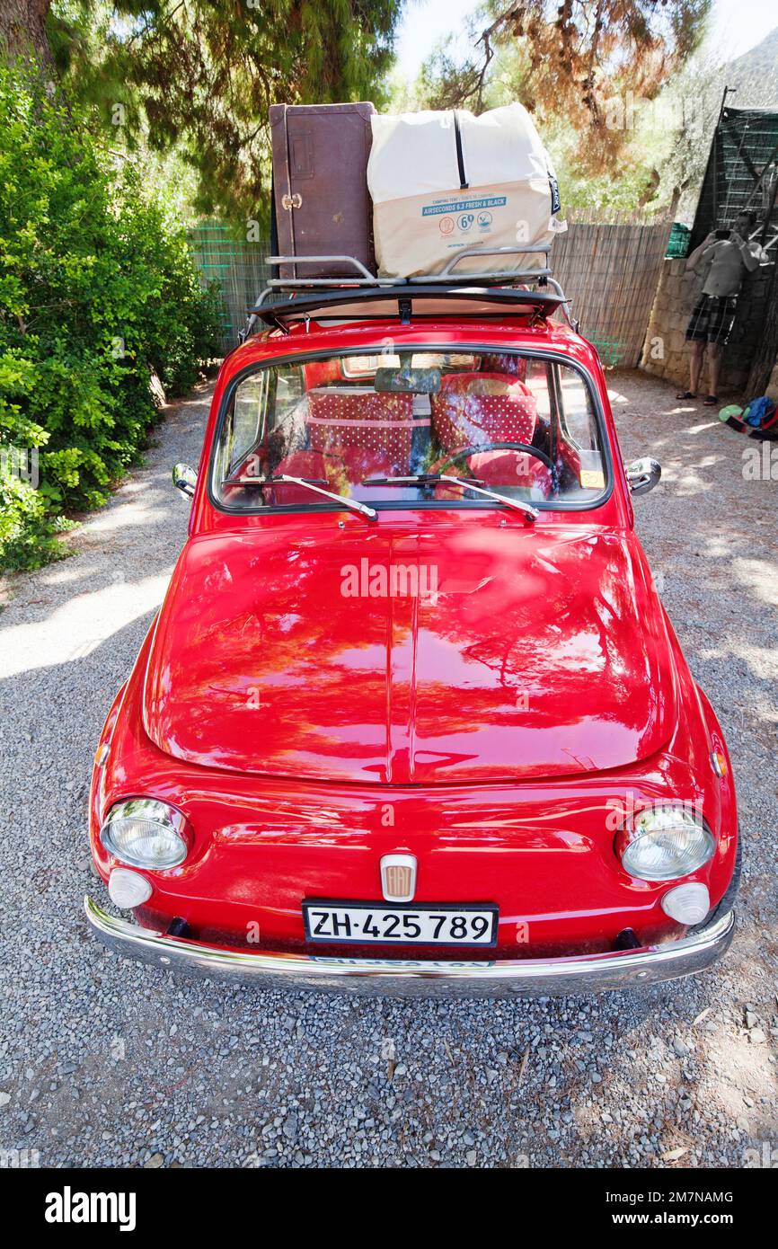 bright red Fiat 500 traveling, Sicily Stock Photo