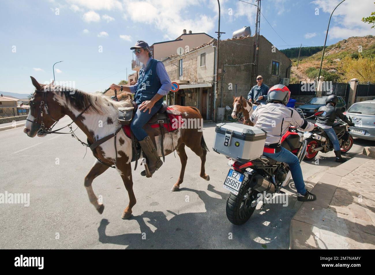 Meeting of riders and bikers in the mountain village of Castelbuono, Sicily Stock Photo