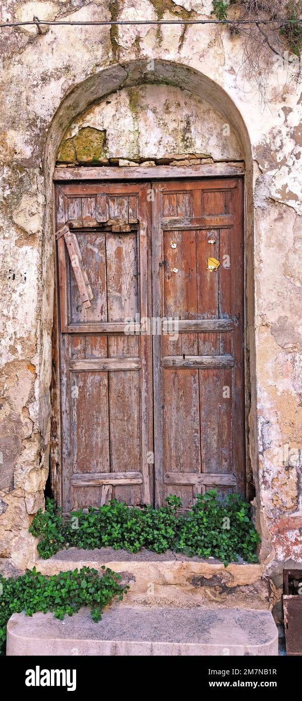 rotten front door at abandoned house in Menfi village, Sicily Stock Photo