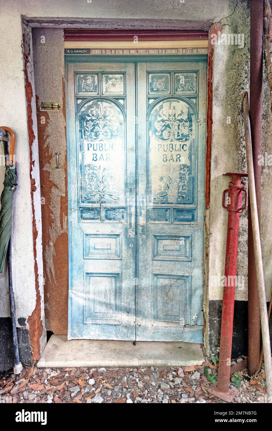Renovation on the house, blue wooden door of a bar in northern Tuscany Stock Photo