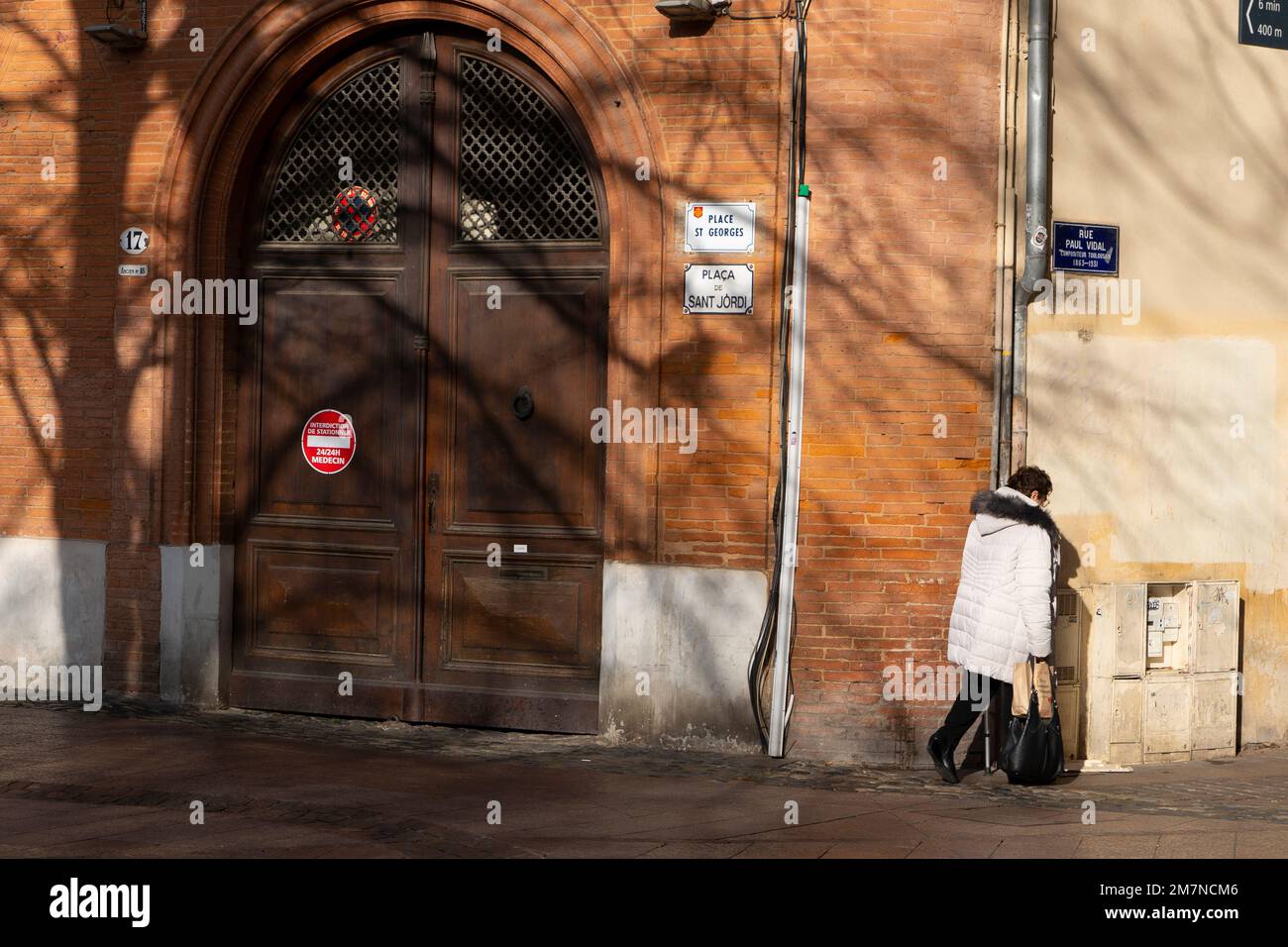 Woman in Place Saint Georges, Toulouse, France. Stock Photo