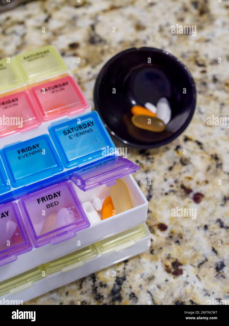 Prescription pill box for medication or vitamins or supplements for daily medication doses. Stock Photo