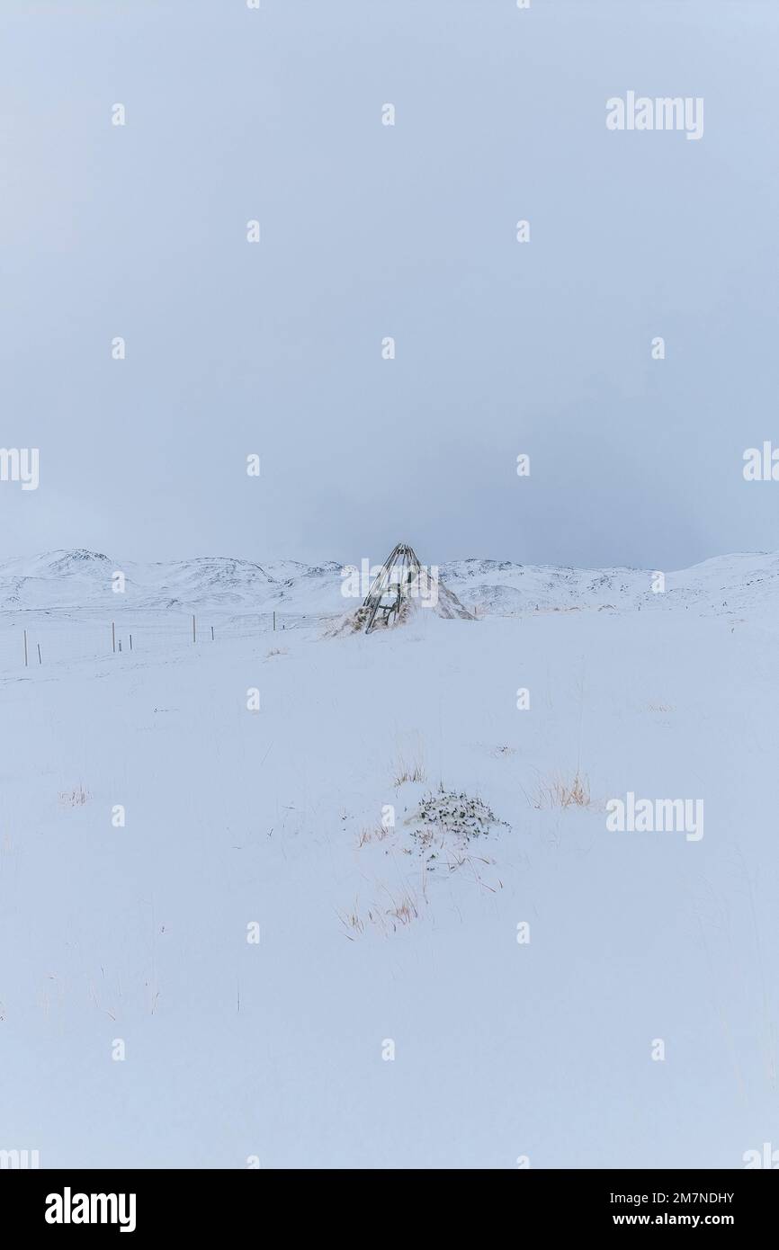 Old teepee in the snow on Magerøya, Norway Stock Photo