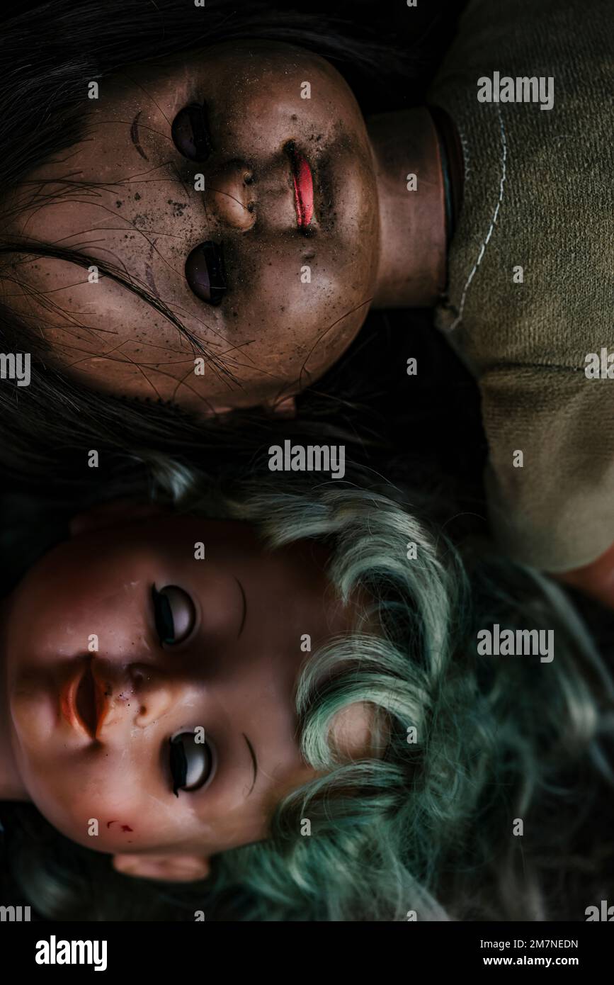 Two old dolls head to head side by side Stock Photo