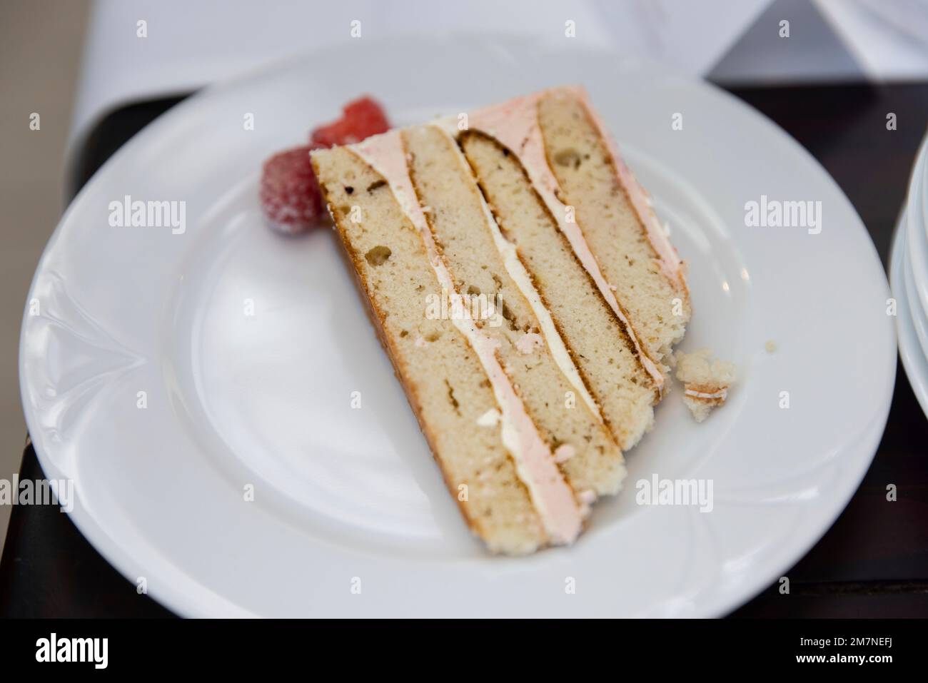 Butter cream cake served on a white plate Stock Photo