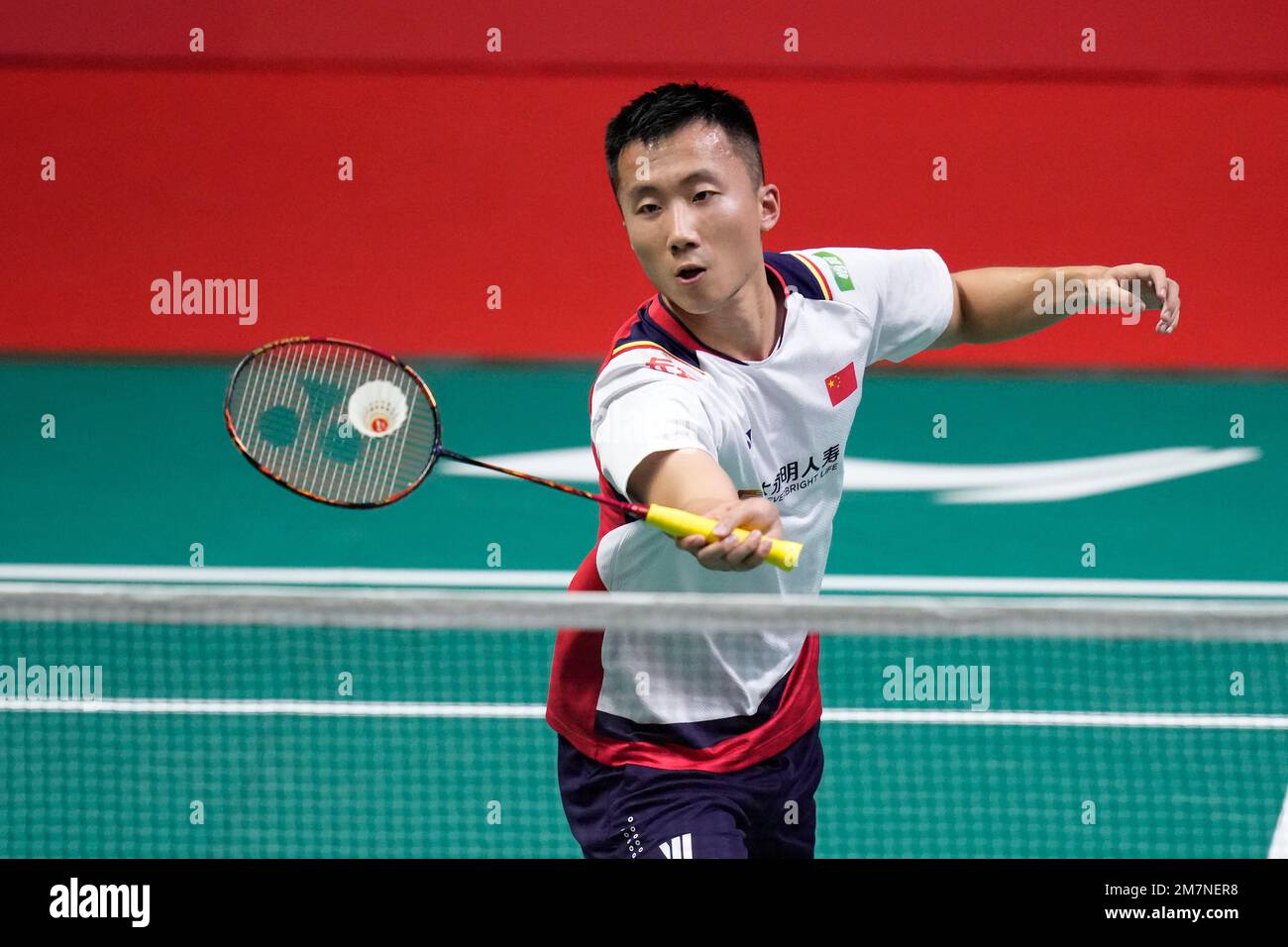 Chinas Lu Guangzu competes against Denmarks Viktor Axelsen during their mens singles Group A badminton match at the BWF World Tour Finals in Bangkok, Thailand, Wednesday, Dec