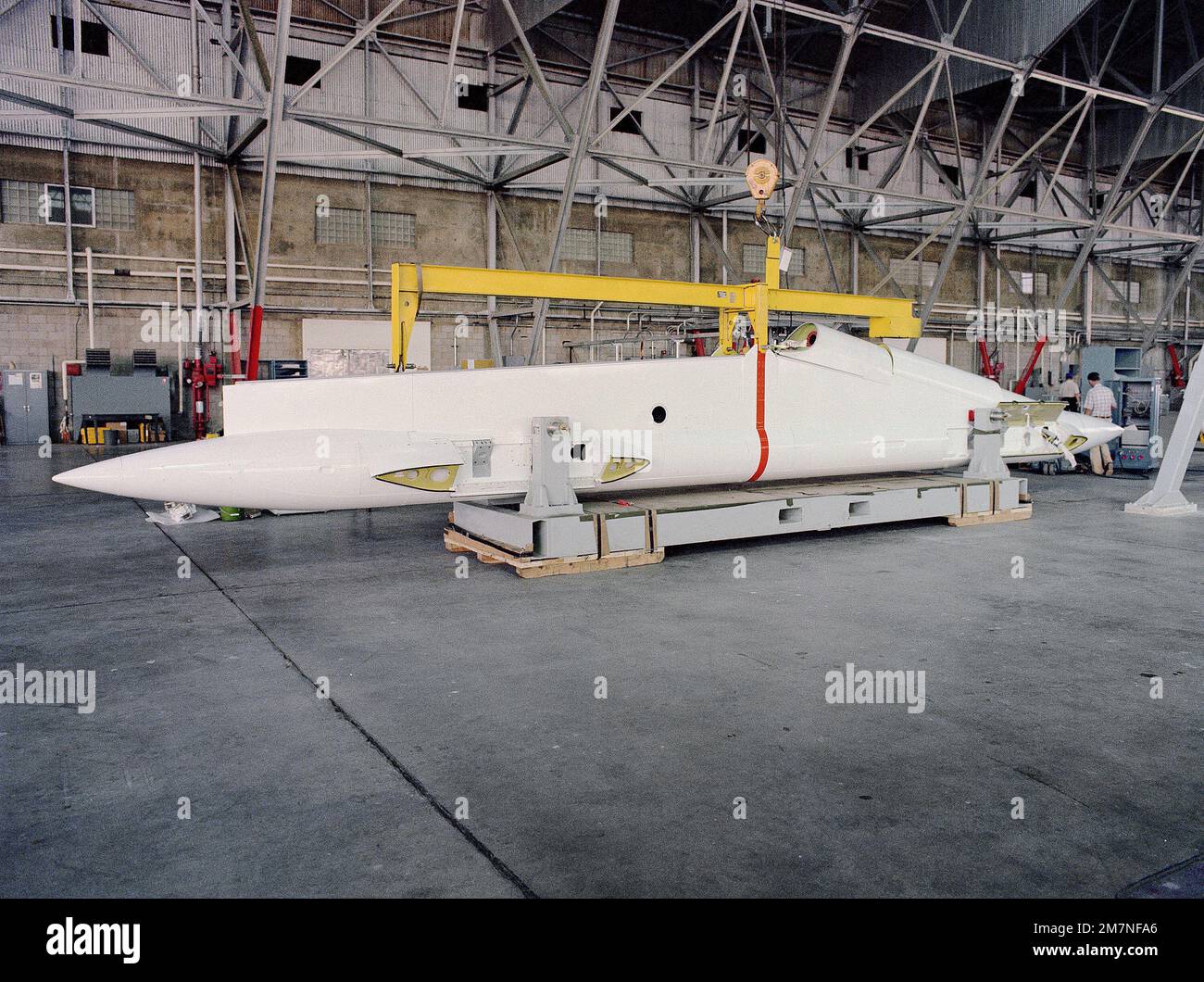 Side view of a B-52 Stratofortress aircraft wing pylon in a hangar. Country: Unknown Stock Photo