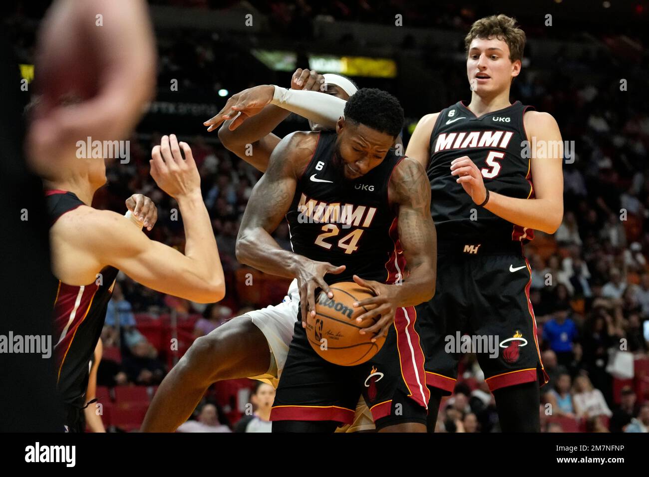Miami Heat forward Haywood Highsmith (24) grabs a rebound during the first  half of an NBA basketball game against the Detroit Pistons, Tuesday, Dec.  6, 2022, in Miami. (AP Photo/Lynne Sladky Stock